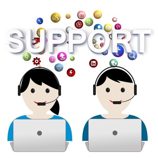 A picture of two cartoon people on laptops with the word support above their heads.